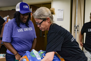 Aisha and a volunteer during early Helene relief efforts