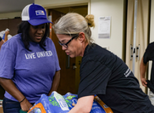 Aisha and a volunteer during early Helene relief efforts