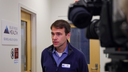 Dan Leroy, of United Way, shares information about School-Based Health Centers with the WLOS news crew. 