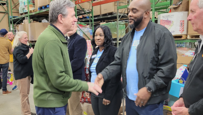 Kevin Montgomery Aisha Shepherd and Governor Roy Cooper